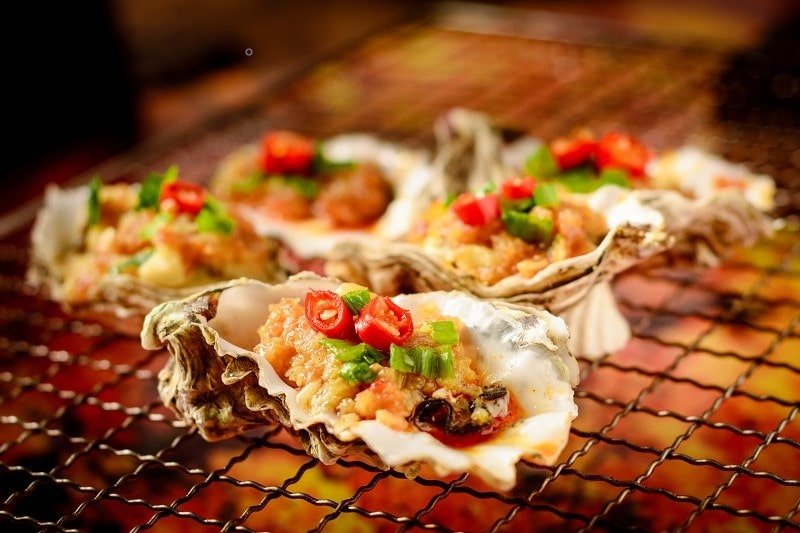 Grilled oysters are an essential part of a barbecue night snack