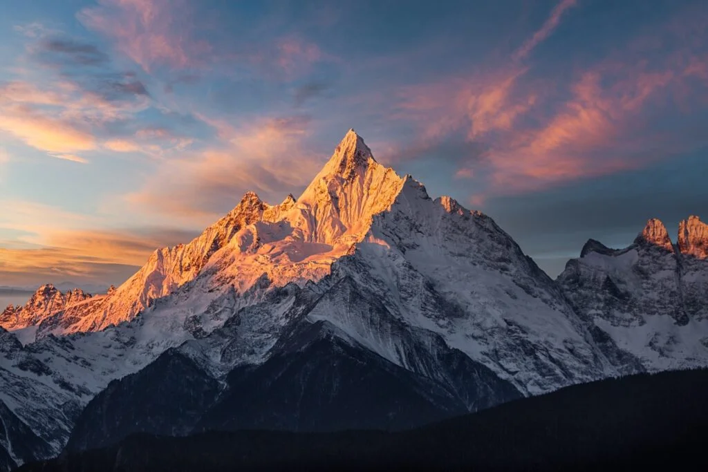 Majestic Qomolangma (Mount Everest) adorned with pristine snow during a breathtaking sunrise