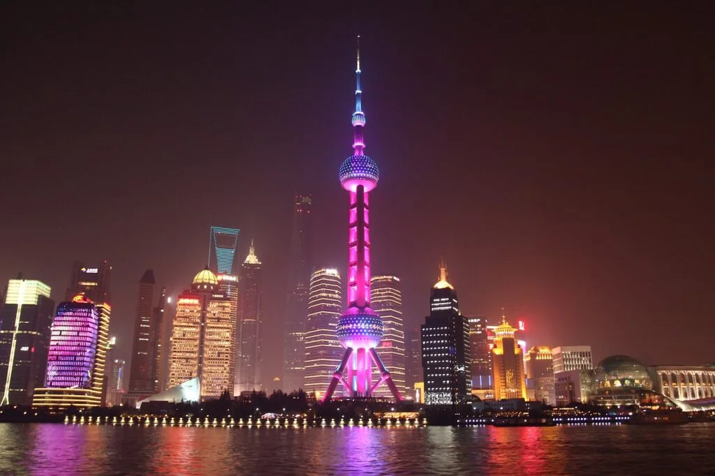 The Bund glows with colorful lights at night