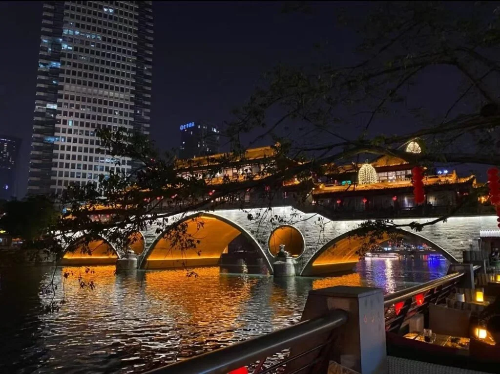 The Jiuyan bridge glowed orange in the dark night