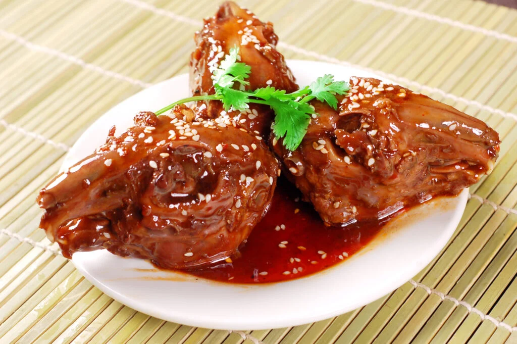 Three delicious spicy rabbit heads on a plate
