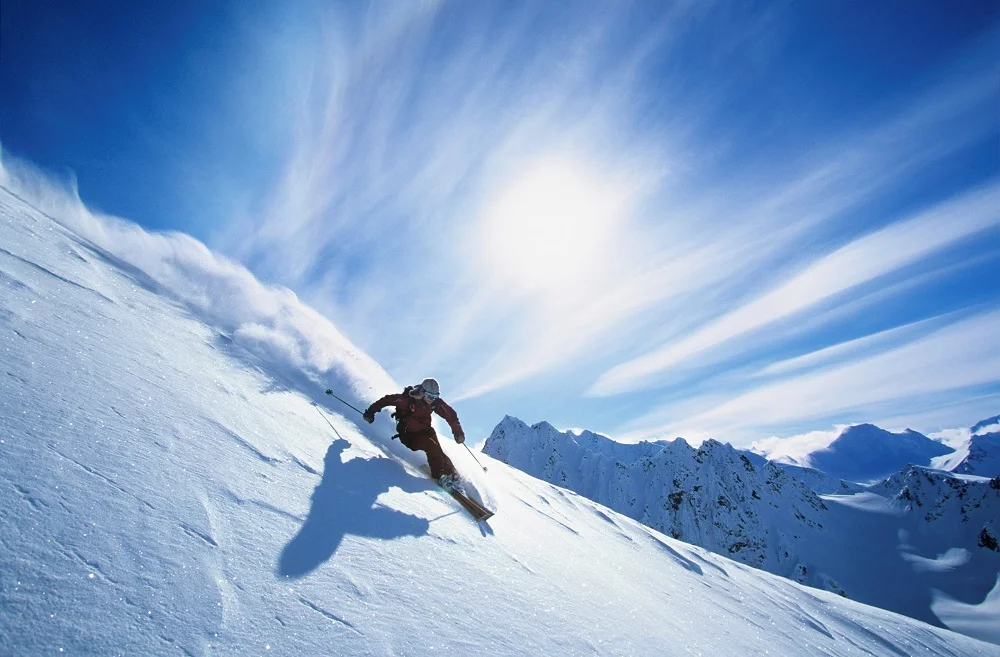 A man is skiing at a ski resort