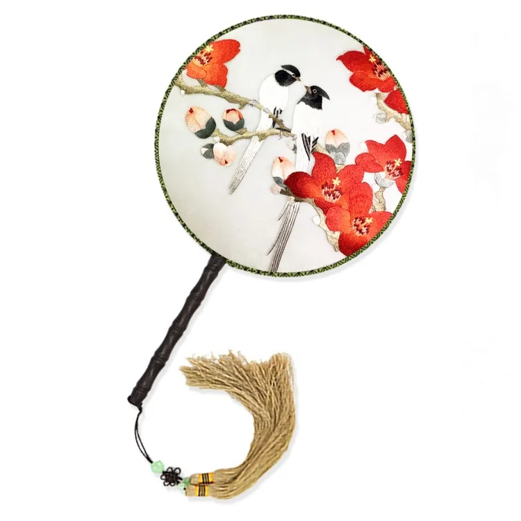 This is a Cantonese embroidery piece, with two small birds standing on top of kapok flowers