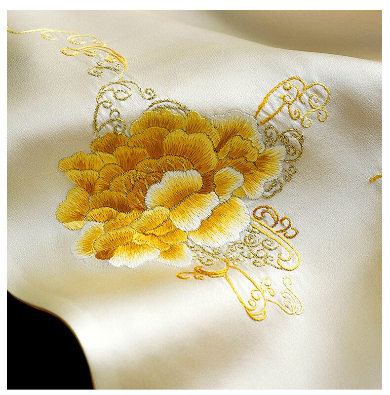 This is a Suzhou embroidery piece, featuring a golden flower embroidered on the fabric