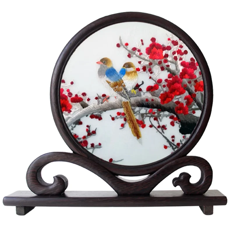 This is a Xiang embroidery piece, with a bird perched on a tree branch