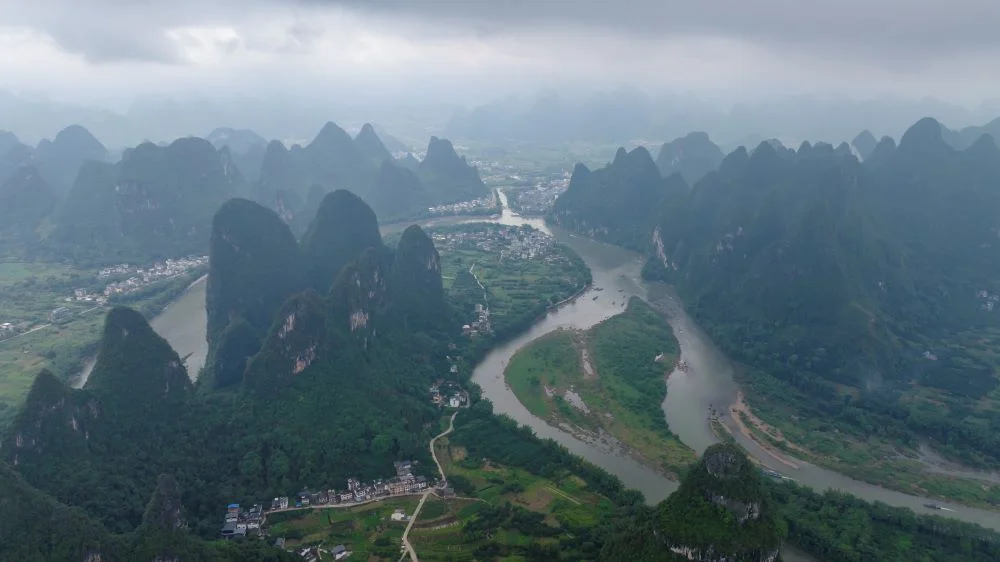 Aerial view of the winding Lijiang River flanked by Guilin’s dramatic karst mountain landscape.