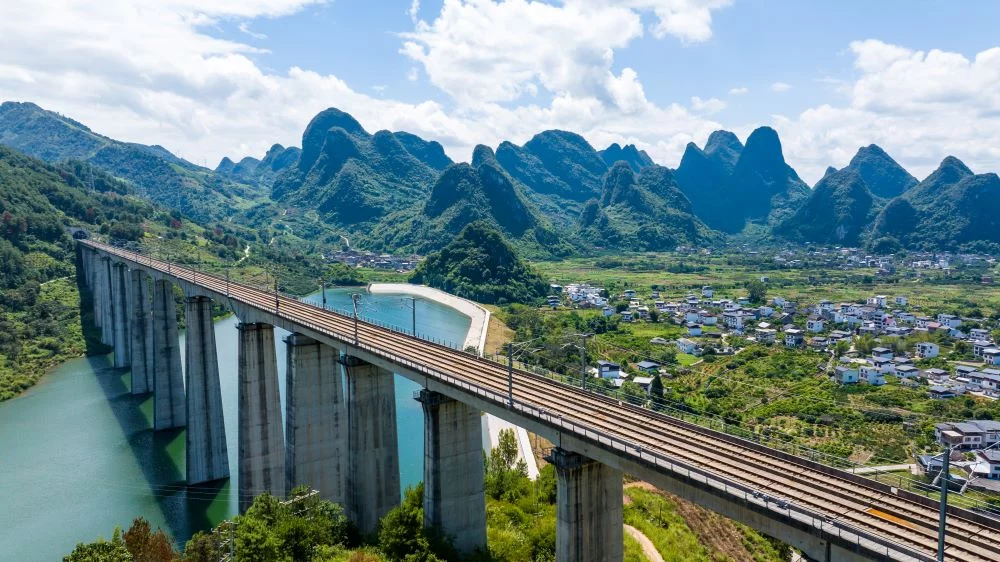 High-Speed Train Passing Over a River in Guilin on the Way to Yangshuo